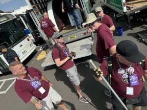 Volunteers unloading props