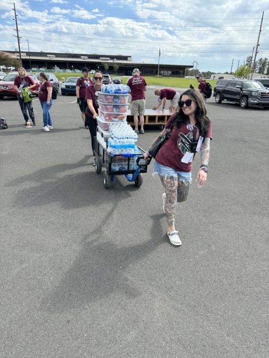 Volunteers bringing water to the band