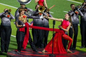 Drum major and guard dancing in heart of steel show